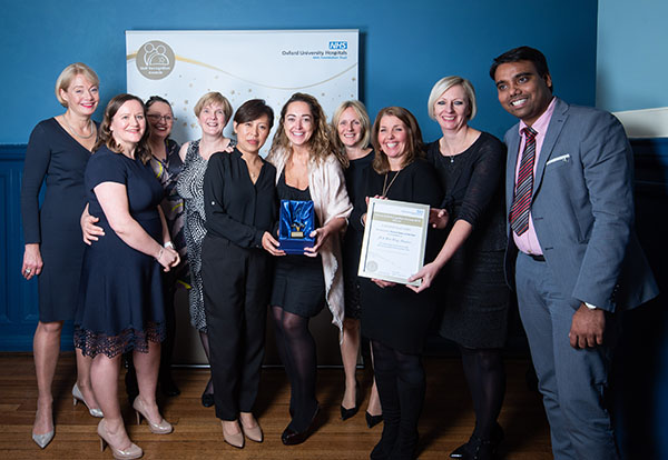 The JR and West Wing Theatres team receives their award