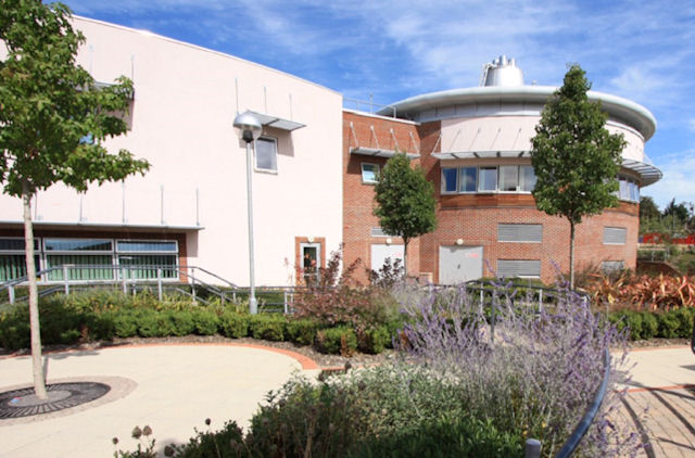 The Nuffield Orthopaedic Centre and garden on a sunny day